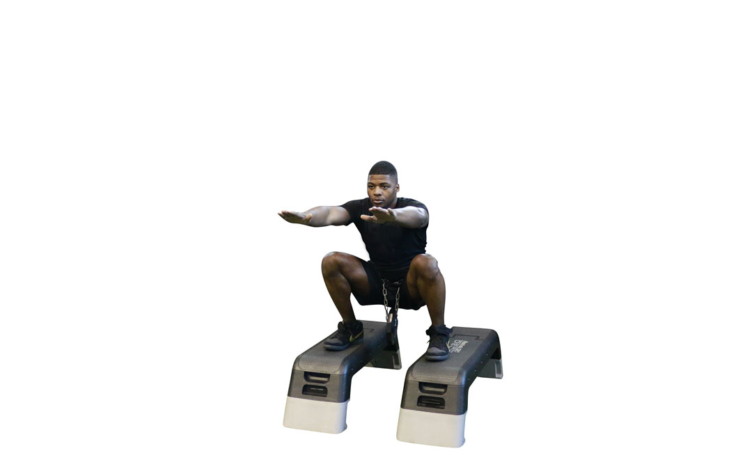 Squat con Disco di Peso — dimostrazione 2